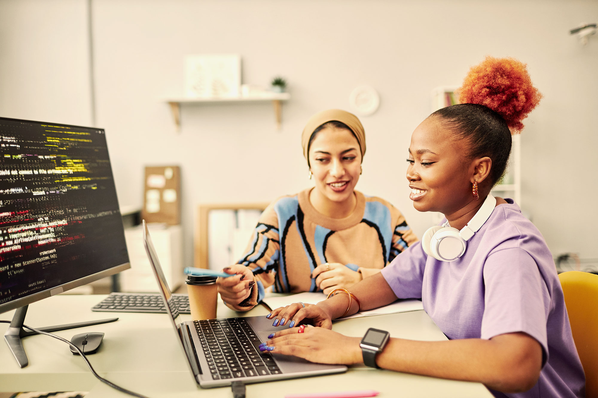 Young employee working with manager.