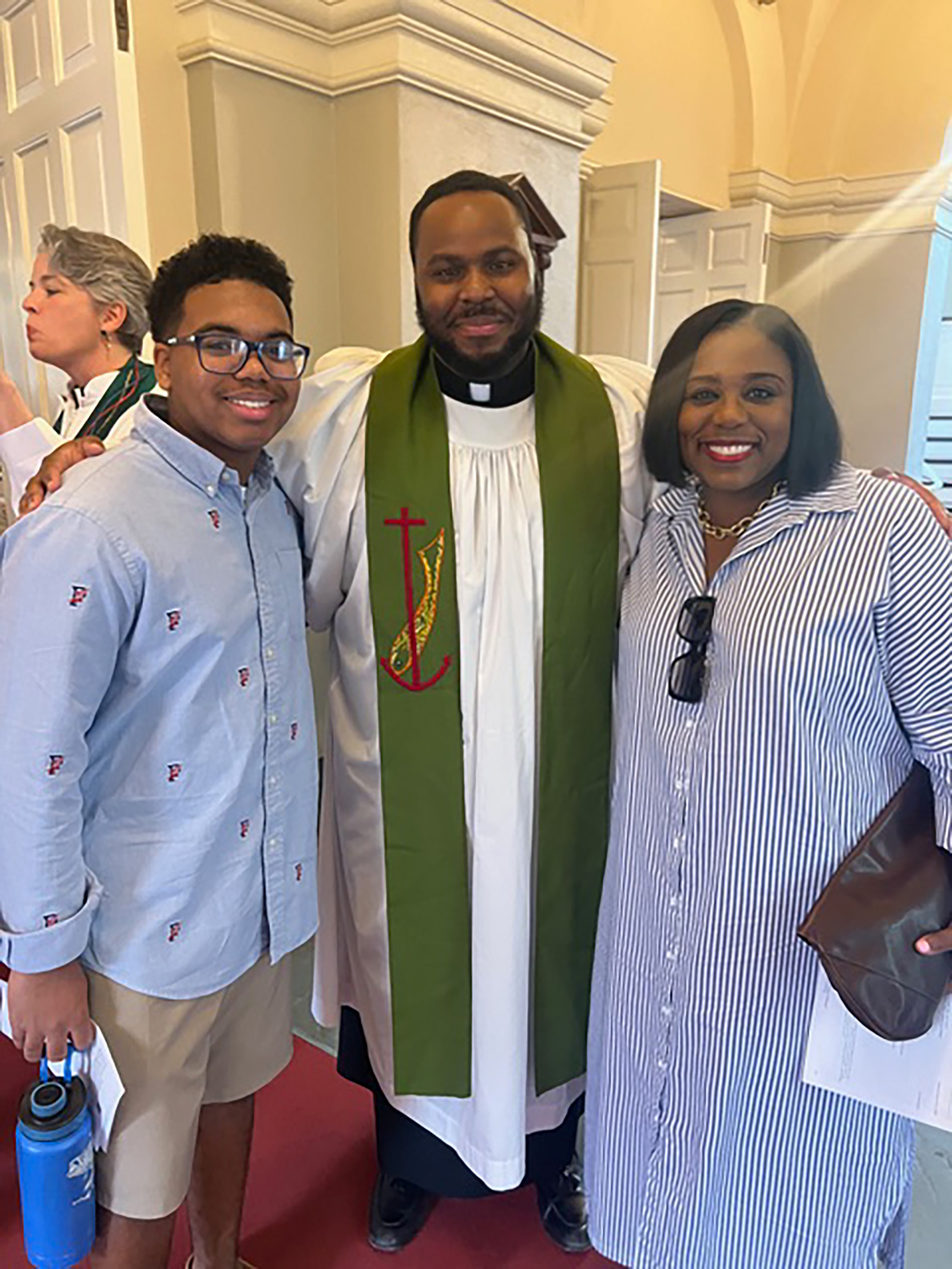 Harvard Summer School student Mark Anthony, Rev. Dr. Calvon Jones, and Markesha Clausell in Harvard's Memorial Church.