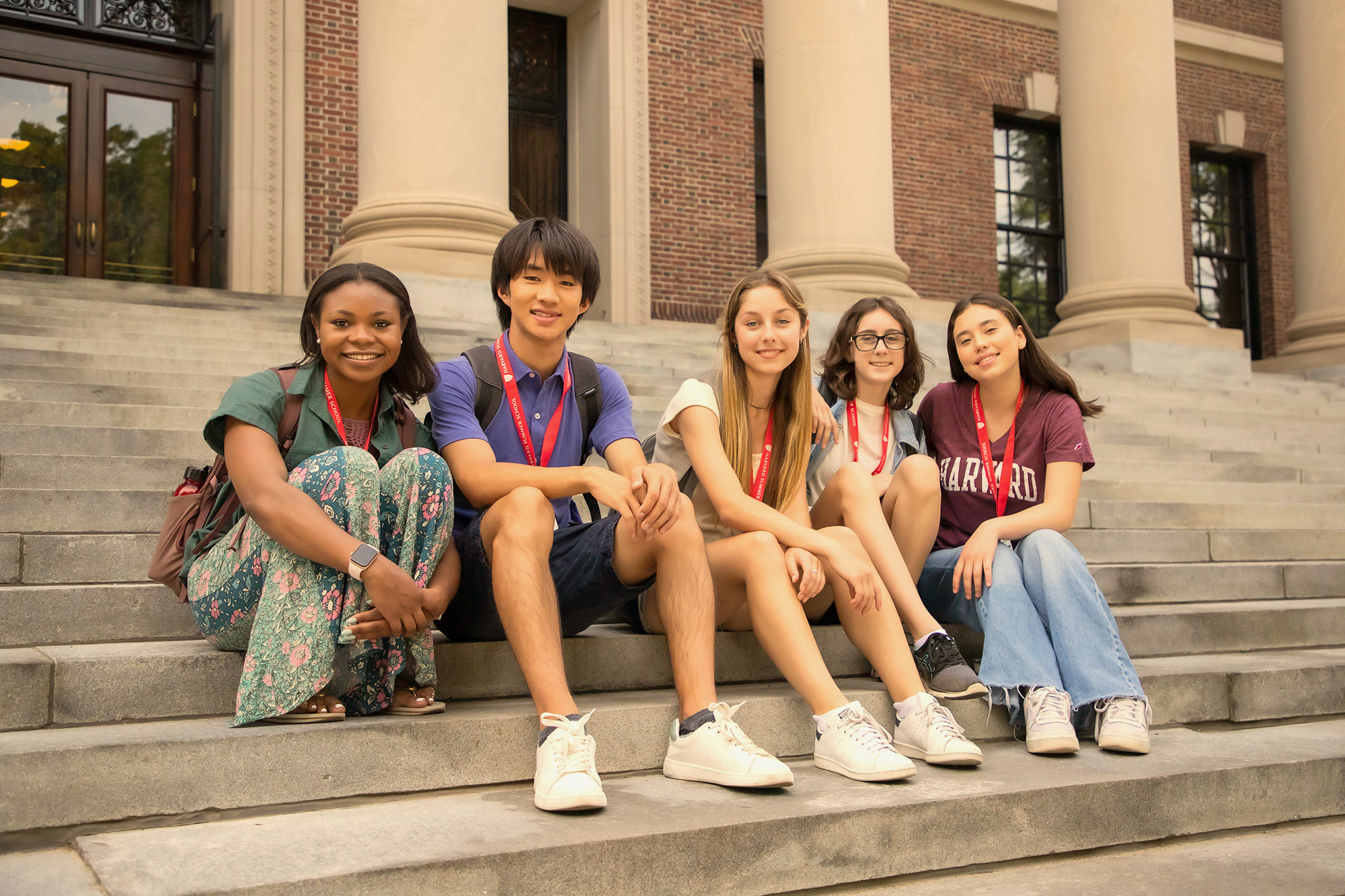 Four Harvard Summer School students on the steps of Widener Library.