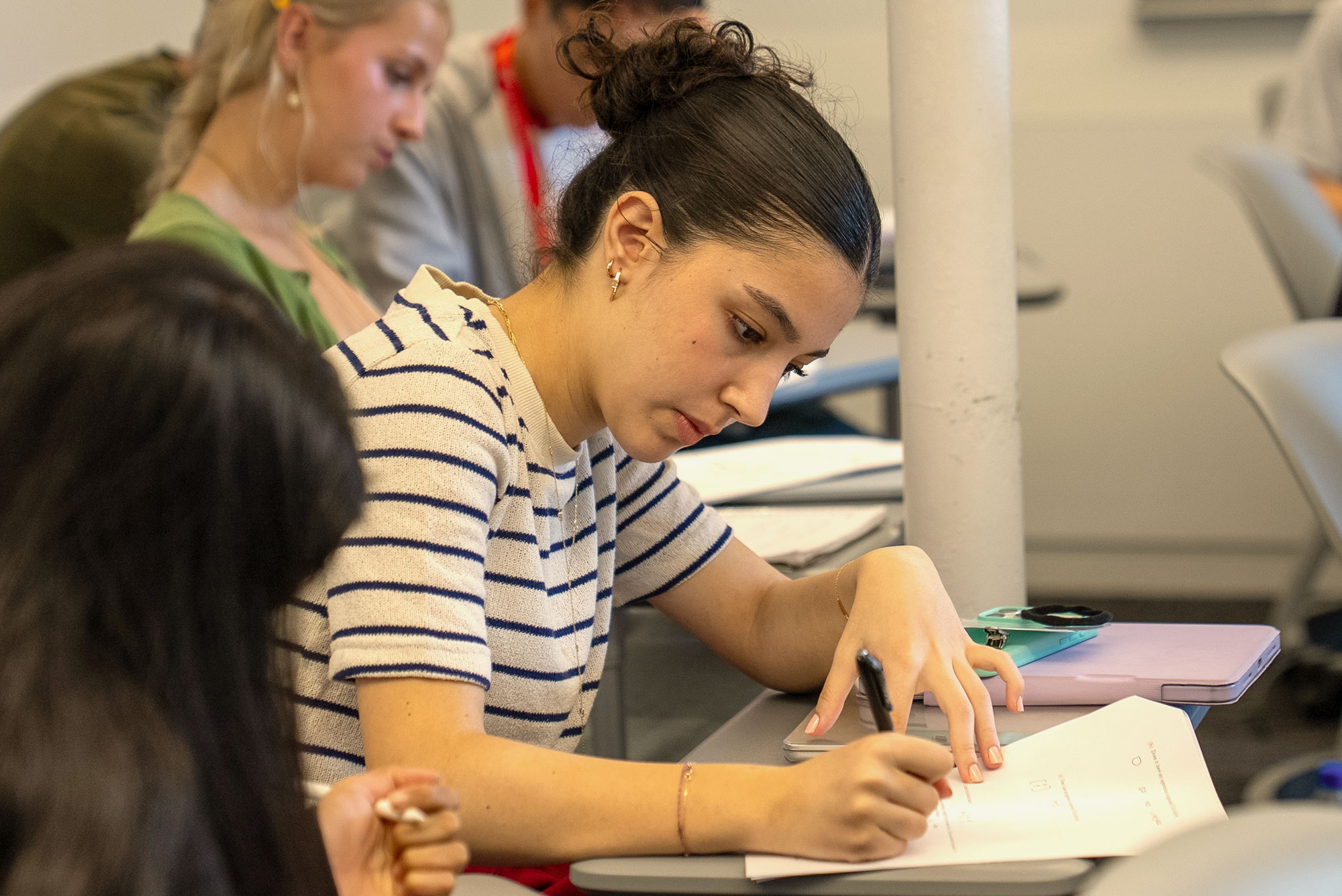 High achool students at Harvard Summer School work in class.